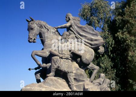 Syria: Statue of Salah al-Din Yusuf Ibn Ayyub (c. 1138 – 4 March 1193), near the Citadel, Damascus.  Ṣalāḥ ad-Dīn Yūsuf ibn Ayyūb, better known in the Western world as Saladin, was a Kurdish Muslim, who became the first Ayyubid Sultan of Egypt and Syria. He led Islamic opposition to the Franks and other European Crusaders in the Levant. At the height of his power, he ruled over Egypt, Syria, Mesopotamia, Hejaz, and Yemen. He led the Muslims against the Crusaders and eventually recaptured Palestine from the Crusader Kingdom of Jerusalem after his victory in the Battle of Hattin. Stock Photo