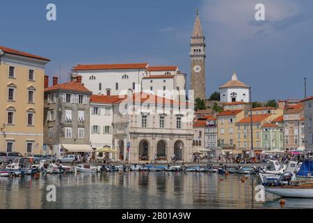 Venetian Port and the Main Square Tartini of Piran city reflected on water, Slovenia. Stock Photo