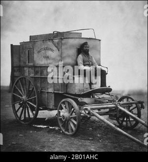 Great Britain/Russia: Roger Fenton's assistant Marcus Sparling seated on the horse-drawn 'Photographic Van' employed by Fenton during the Crimean War (1853-1856), 1855.  Roger Fenton (28 March 1819 – 8 August 1869) was a pioneering British photographer, one of the first war photographers. The Crimean War was one of the first wars to be documented extensively in written reports and photographs, notably by Roger Fenton and William Russell (for the Times). News correspondence reaching Britain from the Crimea was the first time the public were kept informed of the day-to-day realities of war. Stock Photo