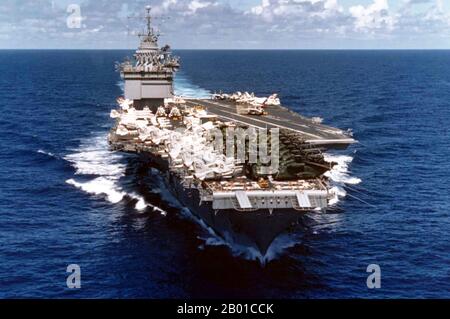 Vietnam/USA: The US Navy carrier USS Enterprise loaded to the gunnels with helicopters and planes evacuated from Saigon, Operation Frequent Wind, 20 May 1975.  The U.S. Navy aircraft carrier USS Enterprise (CVAN-65) underway returning to the United States from a Western Pacific cruise that included the evacuation of Saigon.  The aircraft on her deck include U.S. Marine Corps Sikorsky CH-53 Sea Stallion helicopters, which were hitching a ride home on board the ship.  There are pilots and or crew sunbathing on the forward part of the flight deck. Stock Photo