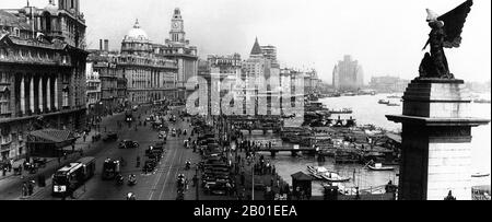 China: Shanghai, The Bund (Waitan), 1930.  The Bund (Chinese: Wàitān) is an area of Huangpu District in central Shanghai. The area centres on a section of Zhongshan Road (East-1 Zhongshan Road) within the former Shanghai International Settlement, which runs along the western bank of the Huangpu River, facing Pudong, in the eastern part of Huangpu District. The Bund usually refers to the buildings and wharves on this section of the road, as well as some adjacent areas. Stock Photo