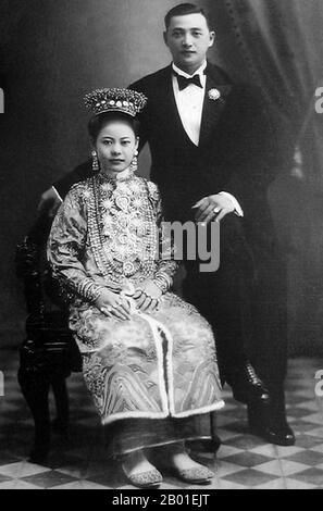 Malaysia: A Peranakan bride and groom, Penang, early 20th century.  Peranakan Chinese and Baba-Nyonya are terms used for the descendants of late 15th and 16th-century Chinese immigrants to the Indonesian-Malay Archipelago during the Colonial era.  Members of this community in Melaka identify themselves as 'Nyonya Baba' instead of 'Baba-Nyonya'. Nyonya is the term for the women and Baba for the men. It applied especially to the ethnic Chinese populations of the British Straits Settlements of Malaya and the Dutch-controlled island of Java and other locations. Stock Photo