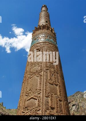 Afghanistan: The Minaret of Jam, Shahrak District, Ghor Province, c. 1190 CE.  The Minaret of Jam is a UNESCO World Heritage Site in western Afghanistan. It is located in the Shahrak District, Ghor Province, by the Hari River. The 65-metre high minaret, surrounded by mountains that reach up to 2400m, was built in the 1190s, entirely of baked-bricks. It is famous for its intricate brick, stucco and glazed tile decoration, which consists of alternating bands of kufic and naskhi calligraphy, geometric patterns, and verses from the Qur'an (the surat Maryam, relating to Mary, the mother of Jesus). Stock Photo