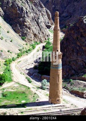 Afghanistan: The Minaret of Jam, Shahrak District, Ghor Province, c. 1190 CE.  The Minaret of Jam is a UNESCO World Heritage Site in western Afghanistan. It is located in the Shahrak District, Ghor Province, by the Hari River. The 65-metre high minaret, surrounded by mountains that reach up to 2400m, was built in the 1190s, entirely of baked-bricks. It is famous for its intricate brick, stucco and glazed tile decoration, which consists of alternating bands of kufic and naskhi calligraphy, geometric patterns, and verses from the Qur'an (the surat Maryam, relating to Mary, the mother of Jesus). Stock Photo