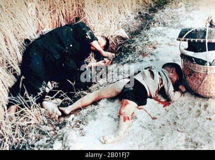 Vietnam: A male victim and child victim of the My Lai massacre or Thảm sát Mỹ Lai, March 6, 1868. Photo by Sgt. Ronald L. Haeberle.  The My Lai Massacre was the Vietnam War mass murder of 347–504 unarmed civilians in South Vietnam on March 16, 1968, by United States Army soldiers of 'Charlie' Company of 1st Battalion, 20th Infantry Regiment, 11th Brigade of the Americal Division.  Most of the victims were women, children (including babies), and elderly people. Many were raped, beaten, and tortured, and some of the bodies were later found to be mutilated. Stock Photo