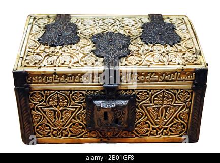 Spain/Al-Andalus: An ivory casket with carved Arabesques, engraved silver and a Kufic inscription. Islamic Spain, Cordoba, 966 CE.  Al-Andalus was the Arabic name given to a nation and territorial region also commonly referred to as Moorish Iberia. The name describes parts of the Iberian Peninsula and Septimania governed by Muslims (often given the generic name of Moors), at various times in the period between 711 and 1492, although the territorial boundaries underwent constant changes due to wars with the Christian Kingdoms. Stock Photo