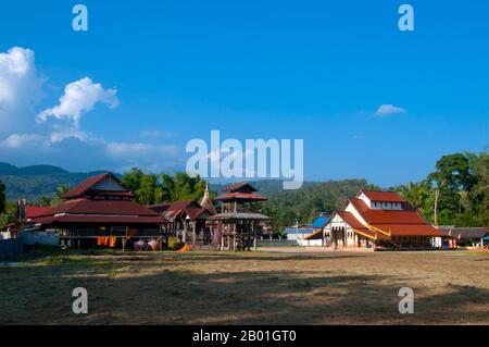 Thailand: Old wooden sala, bell tower and viharn at Wat Si Pho Chai Na Phung, Na Haeo District, Loei Province.  Loei (Thai: เลย) Province is located in Thailand's upper North-East. Neighboring provinces are (from east clockwise) Nong Khai, Udon Thani, Nongbua Lamphu, Khon Kaen, Phetchabun, Phitsanulok. In the north it borders Xaignabouli and Vientiane Provinces of Laos.  The province is covered with low mountains, while the capital Loei is located in a fertile basin. The Loei River, which flows through the province, is a tributary of the Mekong. Stock Photo