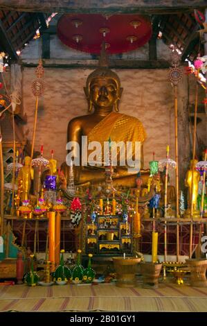 Thailand: Venerable Lao-style seated Buddha image at Wat Si Pho Chai Na Phung, Na Haeo District, Loei Province.  Loei (Thai: เลย) Province is located in Thailand's upper North-East. Neighboring provinces are (from east clockwise) Nong Khai, Udon Thani, Nongbua Lamphu, Khon Kaen, Phetchabun, Phitsanulok. In the north it borders Xaignabouli and Vientiane Provinces of Laos.  The province is covered with low mountains, while the capital Loei is located in a fertile basin. The Loei River, which flows through the province, is a tributary of the Mekong. Stock Photo