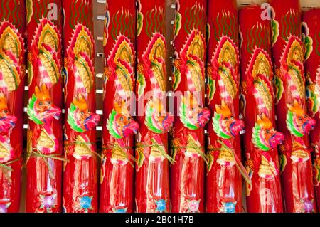 Thailand: Giant candles used in the Meunram Chinese Temple, Trang, Trang Province.  Trang has been a trading centre since at least the 1st century CE. It grew to power and prosperity between the 7th and 13th centuries during the Srivijaya period and remains an important commercial town today.  Rubber, palm oil and fishing are the mainstays of the province's economy. Tourism is making an increasing impact as Trang’s Anadaman Coast and islands are increasingly developed and popularised. The town has a strong Overseas Chinese character (and hence good Chinese restaurants). Stock Photo