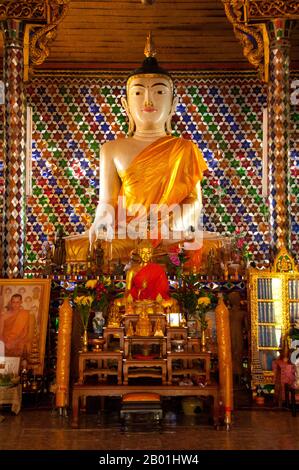 Thailand: Buddha within the viharn at Wat Nong Kham (Pa O temple), Chiang Mai.  The Pa-Oh, also known as Taungthu and Black Karen, are an ethnic group in Burma, comprising approximately 600,000. They form the second largest ethnic group in Shan State, and are believed to be of Tibeto-Burman stock. They are ethnolinguistically related to the Karen and populate Shan State, Kayin State and Kayah State.  King Mengrai founded the city of Chiang Mai (meaning 'new city') in 1296 and it succeeded Chiang Rai as capital of the Lanna kingdom. Chiang Mai is sometimes written as 'Chiengmai' or 'Chiangmai'. Stock Photo