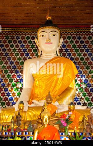 Thailand: Buddha within the viharn at Wat Nong Kham (Pa O temple), Chiang Mai.  The Pa-Oh, also known as Taungthu and Black Karen, are an ethnic group in Burma, comprising approximately 600,000. They form the second largest ethnic group in Shan State, and are believed to be of Tibeto-Burman stock. They are ethnolinguistically related to the Karen and populate Shan State, Kayin State and Kayah State.  King Mengrai founded the city of Chiang Mai (meaning 'new city') in 1296 and it succeeded Chiang Rai as capital of the Lanna kingdom. Chiang Mai is sometimes written as 'Chiengmai' or 'Chiangmai'. Stock Photo