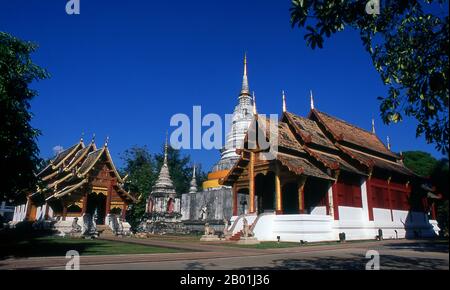 Thailand: Viharn Lai Kam (left), the main chedi and ubosot, Wat Phra Singh, Chiang Mai, Northern Thailand.  Wat Phra Singh or to give it its full name, Wat Phra Singh Woramahaviharn, was first constructed around 1345 by King Phayu, 5th king of the Mangrai Dynasty.  King Mengrai founded the city of Chiang Mai (meaning 'new city') in 1296, and it succeeded Chiang Rai as capital of the Lanna kingdom. Chiang Mai, sometimes written as 'Chiengmai' or 'Chiangmai', is the largest and most culturally significant city in northern Thailand. Stock Photo