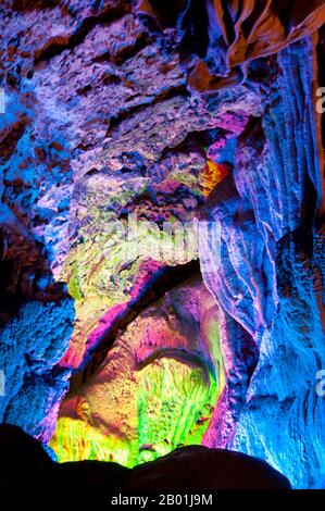 China: Reed Flute Cave, Guilin, Guangxi Province.  Reed Flute Cave takes its name from the reeds that used to grow at the entrance to the cave. These reeds were used to make flutes. The cave is filled with a large number of stalactites, stalagmites and other rock formations. Inside, there are more than 70 inscriptions written in ink, which can be dated back as far as the Tang dynasty.  Guilin is the scene of China’s most famous landscapes, inspiring thousands of paintings over many centuries. They have been called the ‘finest mountains and rivers under heaven’ by poets, artists and tourists. Stock Photo
