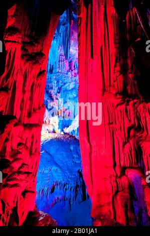China: Reed Flute Cave, Guilin, Guangxi Province.  Reed Flute Cave takes its name from the reeds that used to grow at the entrance to the cave. These reeds were used to make flutes. The cave is filled with a large number of stalactites, stalagmites and other rock formations. Inside, there are more than 70 inscriptions written in ink, which can be dated back as far as the Tang dynasty.  Guilin is the scene of China’s most famous landscapes, inspiring thousands of paintings over many centuries. They have been called the ‘finest mountains and rivers under heaven’ by poets, artists and tourists. Stock Photo