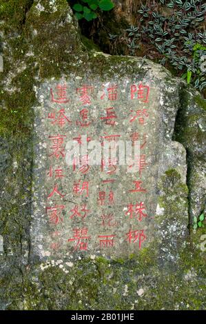 China: Famous calligraphy on Bilian Feng (Green Lotus Peak), central Yangshuo, near Guilin, Guangxi Province.  Yangshuo is rightly famous for its dramatic scenery. It lies on the west bank of the Li River (Lijiang) and is just 60 kilometres downstream from Guilin. Over recent years it has become a popular destination with tourists whilst also retaining its small river town feel.  Guilin is the scene of China’s most famous landscapes, inspiring thousands of paintings over many centuries. They have often been called the ‘finest mountains and rivers under heaven’. Stock Photo