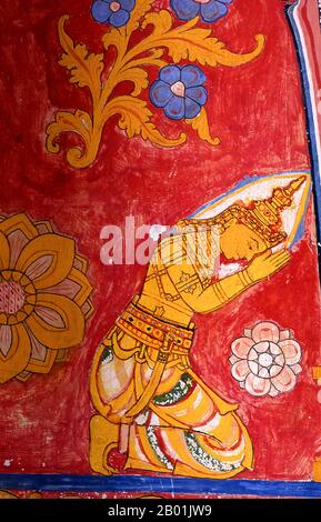 Sri Lanka: A devotee of the Lord Buddha in a wall painting at Asgiriya Vihara (temple), Kandy.  Asgiriya Vihara, the ‘Monastery of the Horse Mountain’, was built by the family of Pilima Talauve in the early 19th century, on a plot adjoining the ancient royal cremation ground. The Asgiriya Vihara is a rather smallish, inconspicuous temple, but as one of the seats of Goyigama religious power, of great significance.  From the early 19th century onwards, during the Esala Perahera, the sacred Tooth Relic would be deposited for the last night of the festival at the Asgiriya Vihara. Stock Photo