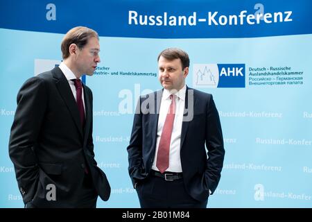 Berlin, Germany. 18th Feb, 2020. Denis Manturov (l), Minister of Industry and Trade of the Russian Federation, and Maxim Oreshkin, Economic Advisor to the President of the Russian Federation, speak at the 7th Russia Conference of the Association of German Chambers of Industry and Commerce (DIHK) and the German-Russian Chamber of Foreign Trade. Around 500 company representatives and numerous guests of honour from politics and business will take part in the conference with the motto 'Innovation as an engine of growth'. Credit: Bernd von Jutrczenka/dpa/Alamy Live News Stock Photo