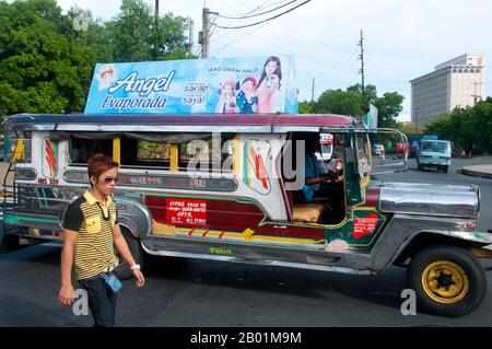 Philippines: Jeepney, Anda Circle, Bonifacio Drive, near Intramuros, Manila.  Jeepneys are the most popular means of public transportation in the Philippines. They were originally made from US military jeeps left over from World War II and are known for their flamboyant decoration and crowded seating. They have become a ubiquitous symbol of Philippine culture. Stock Photo