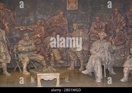 China: Sculpture of conference participants (Mao is seated smoking on the right), Zunyi Conference Hall Revolutionary Museum, Zunyi, Guizhou Province.  The Zunyi Conference was a meeting of the Communist Party of China (CPC) in January 1935 during the Long March. This meeting involved a power struggle between the leadership of Bo Gu and Otto Braun and the opposition led by Mao Zedong. The result was that Mao left the meeting in position to take over military command and become the leader of the Communist Party. The conference was completely unacknowledged until the 1950s. Stock Photo