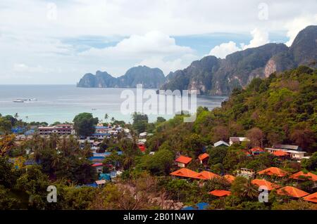 Thailand: Tonsai Bay and Tonsai Village (Ban Ton Sai), Ko Phi Phi Don, Ko Phi Phi.  Ko Phi Phi consists of two islands, Phi Phi Leh and Phi Phi Don, located southeast of Phuket. Both are part of Hat Noppharat Thara Ko Phi Phi National Marine Park.  Set in the centre of the Sea of Phuket, Ko Phi Phi is almost equidistant from Phuket and Krabi and can be reached by boat in around two hours.  Phi Phi Don is the larger of the two islands, with scenic hills, steep cliffs, silken beaches, azure waters and remarkable bird- and sea-life. Stock Photo