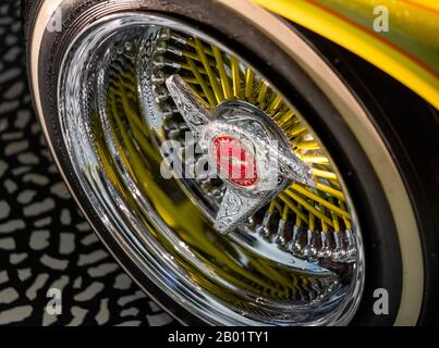 Close up of wheel on customised American Chevrolet Impala car by name of Tipsy/Guardian Angel, exhibited at the Victoria and Albert Museum, London UK Stock Photo