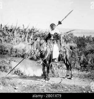 Palestine: A Bedouin warrior on horseback, American Colony of Jerusalem, c. 1898-1914.  Palestine is a name given to the geographic region between the Mediterranean Sea and the Jordan River. The region is also known as the Land of Israel, the Holy Land and the Southern Levant.  In 1832 Palestine was conquered by Muhammad Ali's Egypt, but in 1840 Britain intervened and returned control of the Levant to the Ottomans in return for further capitulations. The end of the 19th century saw the beginning of Zionist immigration and the Revival of the Hebrew language. Stock Photo