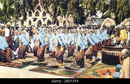 Burma/Myanmar: A yein or chorus dance by a group of young women at a Buddhist festival, 1890s.  Dance in Burma can be divided into dramatic, folk and village, and nat dances, each having distinct characteristics. Although Burmese dance has been influenced by the dance traditions of its neighbours, in particular Thailand, it retains unique qualities that distinguish it from other regional styles, including angular, fast-paced and energetic movements and emphasis on pose, not movement.  Various types of Burmese music use an array of traditional musical instruments, assembled in an orchestra. Stock Photo