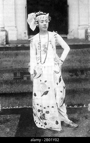 Burma/Myanmar: The Mintha Sabair Tin on the steps of the Haw or Shan sawbwa's palace at Hsipaw, 1930s.  Dance in Burma can be divided into dramatic, folk and village, and nat dances, each having distinct characteristics. Although Burmese dance has been influenced by the dance traditions of its neighbours, in particular Thailand, it retains unique qualities that distinguish it from other regional styles, including angular, fast-paced and energetic movements and emphasis on pose, not movement.  Various types of Burmese music use an array of traditional musical instruments. Stock Photo