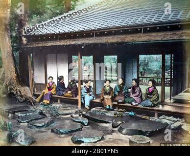 Japan: 'Tea House Girls' at a tea pavilion in a park,  1890s.  The Japanese tea ceremony, also called the Way of Tea, is a Japanese cultural activity involving the ceremonial preparation and presentation of matcha, powdered green tea. In Japanese, it is called chanoyu or chadō, sadō. The manner in which it is performed, or the art of its performance, is called otemae. Zen Buddhism was a primary influence in the development of the tea ceremony.  Tea gatherings are classified as chakai or chaji. Stock Photo