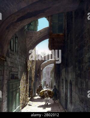 Palestine: The Via Dolorosa, Jerusalem, 1919.  Palestine is a name given to the geographic region between the Mediterranean Sea and the Jordan River. The region is also known as the Land of Israel (Eretz-Yisra'el), the Holy Land and the Southern Levant.  In 1832 Palestine was conquered by Muhammad Ali's Egypt, but in 1840 Britain intervened and returned control of the Levant to the Ottomans in return for further capitulations. The end of the 19th century saw the beginning of Zionist immigration and the Revival of the Hebrew language. Stock Photo