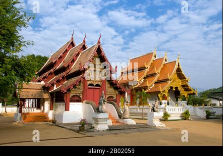 Wat Hang Dong วัด หางดง is a typical example of traditional Lan Na temple architecture. The old viharn at this temple is a little more elaborate than its counterpart at nearby Wat Ton Kwen, but is essentially similar in shape, style and appearance. Also dark and intimate, with a low, sweeping, three-tiered roof, the viharn shelters a collection of Buddha images, at least two of which – to the right and left of the main Buddha image – are distinctively Lao in style and yet somehow strangely primitive.  The old viharn at Wat Hang Dong has now been beautifully restored, and a new ubosot has also Stock Photo