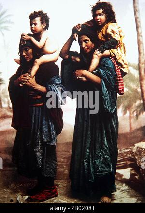 Palestine: Bedouin women carrying children on their shoulders. Félix Bonfils, late 19th century.  Palestine is a name given to the geographic region between the Mediterranean Sea and the Jordan River. The region is also known as the Land of Israel (Eretz-Yisra'el), the Holy Land and the Southern Levant.  In 1832 Palestine was conquered by Muhammad Ali's Egypt, but in 1840 Britain intervened and returned control of the Levant to the Ottomans in return for further capitulations. The end of the 19th century saw the beginning of Zionist immigration and the revival of the Hebrew language. Stock Photo