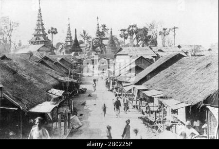 Burma/Myanmar: The main street of Bhamo, Kachin State, c. 1893.  Bhamo (known to the Chinese as Xinkai, or 'New Market'), was once an important town on the Haw caravan trade route between China and Burma. Within the Shan and Karen inhabited regions of northern and eastern Burma trade routes ran to Myitkyina, Lashio and Bhamo. Large mule caravans, some 'half a mile long' were still arriving in Bhamo as late as the 1920s. Stock Photo