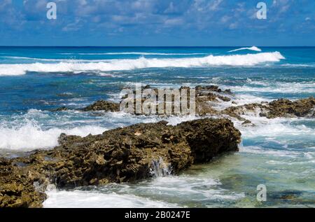 Maldives: Waves break on the coral reef which is very close to the ...