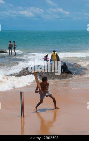 Sri Lanka: Cricket being played on the beach at Mount Lavinia, south of Colombo.  Cricket is the most popular sport in Sri Lanka. Sri Lanka is one of the ten nations that take part in test cricket and one of the five nations that has won a cricket world cup. Cricket is played at professional, semi-professional and recreational levels in the country and international cricket matches are watched with interest by a large proportion of the population.  Cricket was first brought to the island by the British and is believed to have first been played there around 1800. Stock Photo