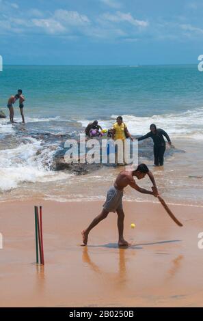 Sri Lanka: Cricket being played on the beach at Mount Lavinia, south of Colombo.  Cricket is the most popular sport in Sri Lanka. Sri Lanka is one of the ten nations that take part in test cricket and one of the five nations that has won a cricket world cup. Cricket is played at professional, semi-professional and recreational levels in the country and international cricket matches are watched with interest by a large proportion of the population.  Cricket was first brought to the island by the British and is believed to have first been played there around 1800. Stock Photo
