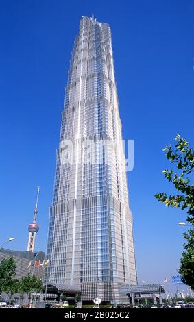 The Jin Mao Tower, at 421m (1,381ft) was until 2007 the highest building in China. Its postmodern form, whose complexity rises as it ascends, draws on traditional Chinese architecture such as the tiered pagoda, gently stepping back to create a rhythmic pattern as it rises.  Shanghai began life as a fishing village, and later as a port receiving goods carried down the Yangzi River. From 1842 onwards, in the aftermath of the first Opium War, the British opened a ‘concession’ in Shanghai where drug dealers and other traders could operate undisturbed. French, Italians, Germans, Americans and Japan Stock Photo