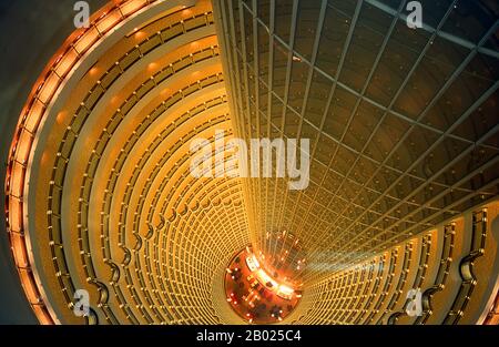 The Jin Mao Tower, at 421m (1,381ft) was until 2007 the highest building in China. Its postmodern form, whose complexity rises as it ascends, draws on traditional Chinese architecture such as the tiered pagoda, gently stepping back to create a rhythmic pattern as it rises.  Shanghai began life as a fishing village, and later as a port receiving goods carried down the Yangzi River. From 1842 onwards, in the aftermath of the first Opium War, the British opened a ‘concession’ in Shanghai where drug dealers and other traders could operate undisturbed. French, Italians, Germans, Americans and Japan Stock Photo