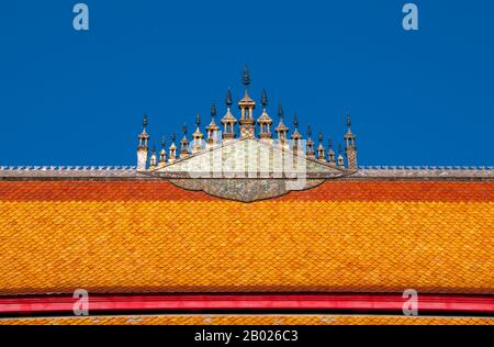 Dok so faa are elaborate temple roof decorations that usually represent the universe and Mount Meru.  Mount Meru (Sanskrit: मेरु), also called Sumeru i.e. the 'Excellent Meru' and Mahameru i.e. 'Great Meru' (Japanese: 須弥山 Shumi-sen), is a sacred mountain in Hindu, Jain as well as Buddhist cosmology and is considered to be the center of all the physical, metaphysical and spiritual universes. It is also the abode of Lord Brahma and the Demi-Gods (Dev).   Wat Nong Sikhounmuang (Sikhunmuang) was originally built in 1729. It was burnt down in 1774, but the bronze Buddha statue that can still be fou Stock Photo