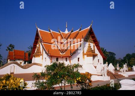 Wat Phumin was constructed in 1596 and is famous for its cruciform viharn ubosot (many temples in the Nan area combine these two buildings into one) and well preserved Tai Lue murals depicting everyday life in the 19th century.  Nan dates from the mid-14th century and for much of its history was an isolated kingdom. The present day city spreads out along the Nan River's right bank. Stock Photo