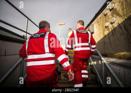 Clinical lead Darren Monaghan (left) and operational lead Glenn OÕRorke of the Northern Ireland Helicopter Emergency Medical Service (HEMS) walk to the helipad at the Royal Victoria Hospital in West Belfast, where the first test landing of an air ambulance helicopter took place on Tuesday. Stock Photo