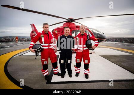 (left to right) Clinical lead Darren Monaghan, pilot Rich Steele and operational lead Glenn O'Rorke of the Northern Ireland Helicopter Emergency Medical Service (HEMS) on the helipad at the Royal Victoria Hospital in West Belfast, where the first test landing of an air ambulance helicopter took place on Tuesday. Stock Photo