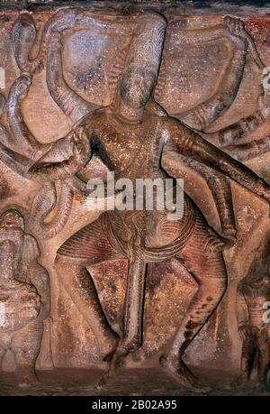 Nataraja or Nataraj ('The Lord - or King - of Dance'; Tamil: Kooththan) is a depiction of the Hindu god Shiva as the cosmic dancer Koothan who performs his divine dance to destroy a weary universe and make preparations for god Brahma to start the process of creation.  Ravana Phadi cave temple is one of the oldest rock cut temples in Aihole and dates back to the 6th century CE. It is dedicated to the Hindu god Shiva. The cave contains a Shivalinga in the inner room or sanctum sanctorum. The sanctum has a vestibule with a triple entrance and has carved pillars. The walls and sides of the temple Stock Photo