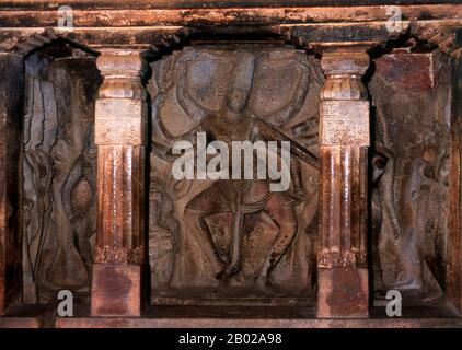 Nataraja or Nataraj ('The Lord - or King - of Dance'; Tamil: Kooththan) is a depiction of the Hindu god Shiva as the cosmic dancer Koothan who performs his divine dance to destroy a weary universe and make preparations for god Brahma to start the process of creation.  Ravana Phadi cave temple is one of the oldest rock cut temples in Aihole and dates back to the 6th century CE. It is dedicated to the Hindu god Shiva. The cave contains a Shivalinga in the inner room or sanctum sanctorum. The sanctum has a vestibule with a triple entrance and has carved pillars. The walls and sides of the temple Stock Photo