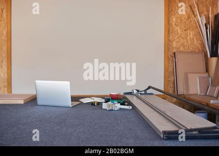 Mat cutter and laptop on a framing shop table Stock Photo