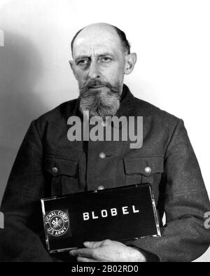 In 1933 Blobel joined the police force in Düsseldorf. In June 1934 he was recruited into the SD or Sicherheitsdienst, the security service of the SS and the Nazi Party. In June 1941 he became the commanding officer of Sonderkommando 4a of Einsatzgruppe C that was active in the Ukraine. Following Wehrmacht troops into the Ukraine, the Einsatzgruppen would be responsible for liquidating political and racial undesirables.  Blobel, in conjunction with Reichenau's and Friedrich Jeckeln's units, organized the Babi Yar massacre in late September 1941 in Kiev, where 33,771 Jews were murdered. Up to 59 Stock Photo