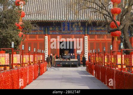 Beijing Dongyue Temple, literally Beijing Eastern Peak Temple, was built between 1314 and 1320, when it was one of the largest Taoist temples in Beijing. The complex has three courtyards. In the centre of the Hall of Taishan Mountain are statues of the God of Taishan Mountain and his high-ranking attendants. Corridors house 72 statues of deities, called 'chiefs of departments', some handing out harsh punishments to people who have done bad things.  Dongyue Temple was burned down during a battle in the Yuan dynasty (1271 - 1368) and was rebuilt during the Ming dynasty (1368 - 1644). The current Stock Photo