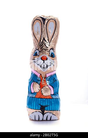 Chocolate Easter bunny on an isolated white background, male figure, Easter candy, specially for children, egg hunt Stock Photo