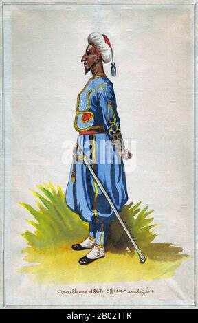 Sometimes referred to in contemporaneous French literature as 'Turcos', this indigenous officer is clearly of Maghribi (Northwest African) origin, probably Algerian or Moroccan.  Zouave was the title given to certain light infantry regiments in the French Army, normally serving in French North Africa between 1831 and 1962. The name was also adopted during the 19th century by units in other armies, especially volunteer regiments raised for service in the American Civil War. The chief distinguishing characteristics of such units were the zouave uniform, which included short open-fronted jackets, Stock Photo