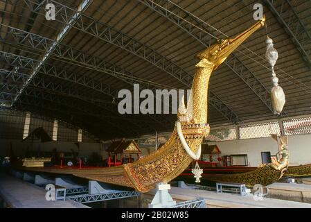 Suphannahongse (Suphannahong), the King's personal barge, was carved out of one teak tree and completed in 1911.  Thailand's royal barges have been used in ceremonies on Bangkok's Chao Phraya River since the 18th century, but were also used prior to this period in the Ayutthayan era.  The exquisitely crafted Royal Barges are a blend of craftsmanship and traditional Thai art. The Royal Barge Procession takes place rarely, typically coinciding with only the most significant cultural and religious events. During the reign of King Bhumibol Adulyadej spanning over 60 years the Procession has only o Stock Photo